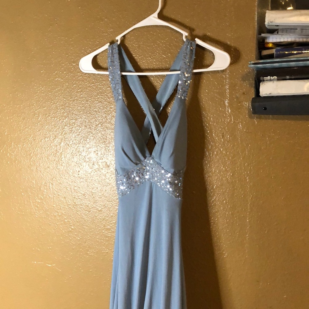 Blue dress worn once at prom. No tags. Backless. Silver sequins.